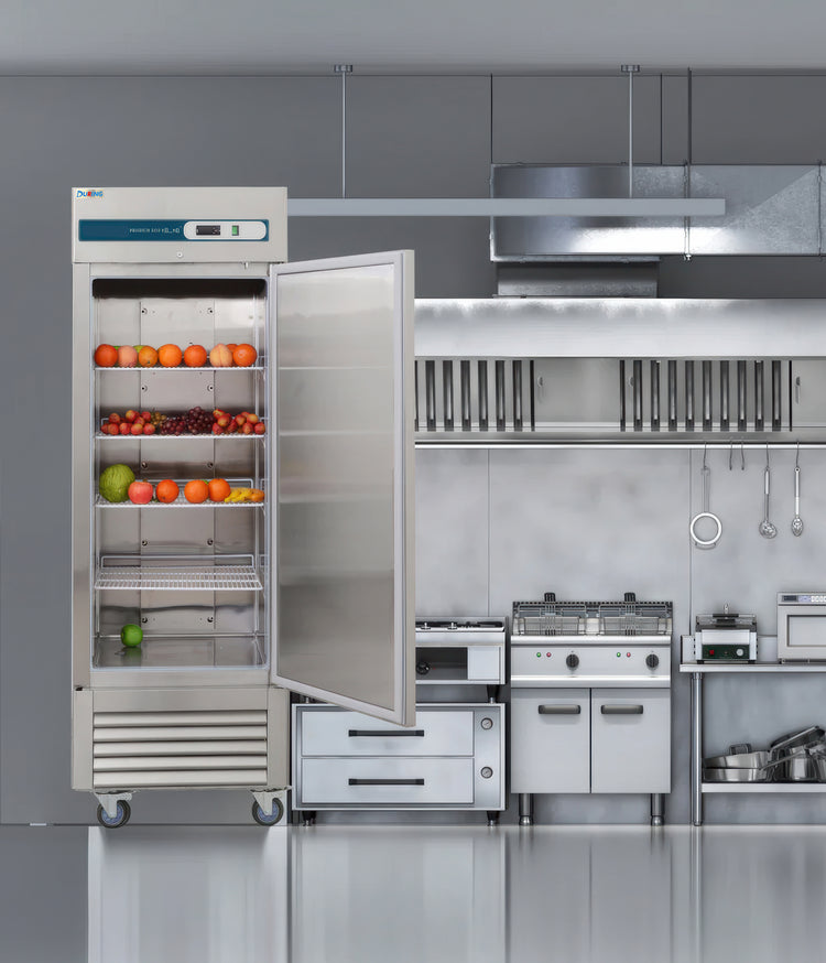 Commercial kitchen with a large stainless steel refrigerator and various appliances.