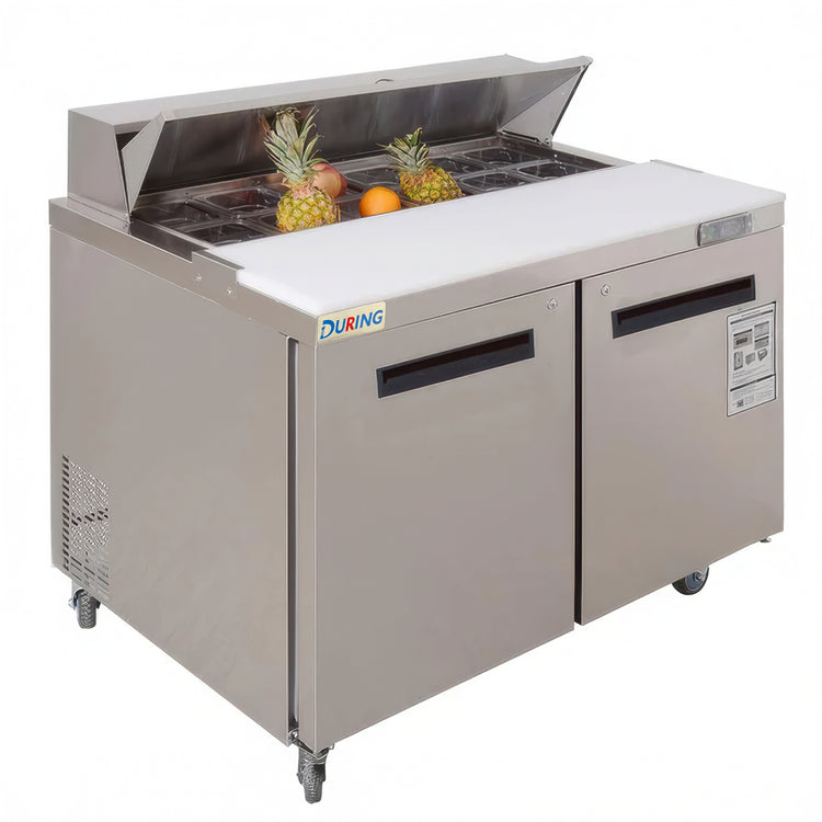 Stainless steel refrigerated counter with fruits on a white background