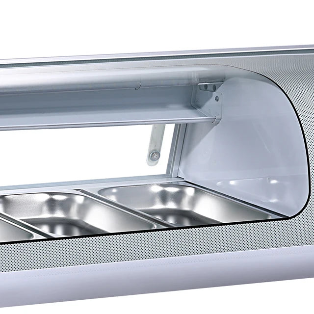 Close-up of a kitchen sink with a glass cover on a white background